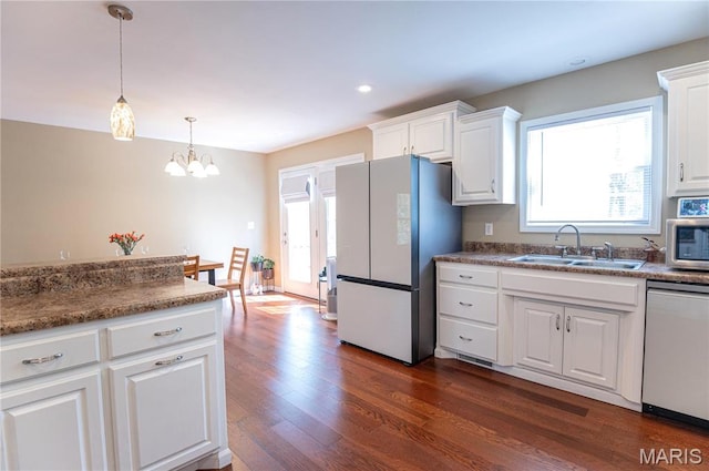 1700 Palmer Ct, Rolla, MO 65401 - kitchen with stainless steel appliances, a sink, dark wood finished floors, white cabinetry, and a chandelier
