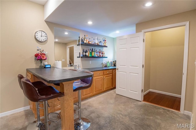 1700 Palmer Ct, Rolla, MO 65401 - indoor bar with baseboards and recessed lighting