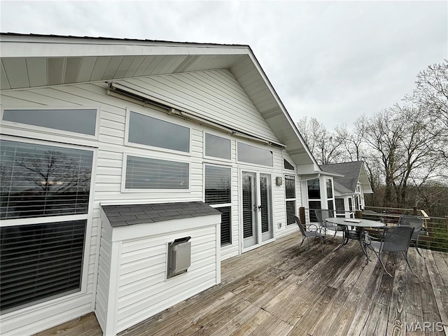 wooden terrace featuring outdoor dining area