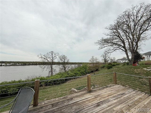 wooden terrace with a water view