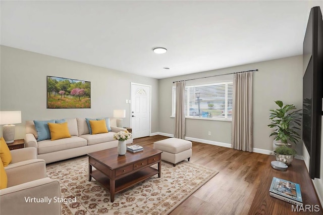 9738 Traverse Ln, Saint Louis, MO 63134 - living room featuring baseboards and wood finished floors