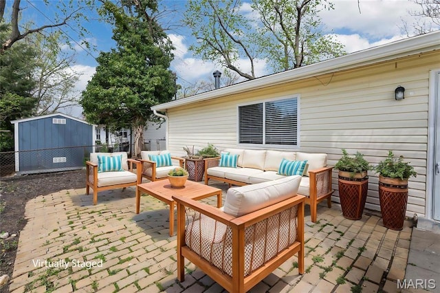 9738 Traverse Ln, Saint Louis, MO 63134 - view of patio with outdoor lounge area, fence, and an outbuilding