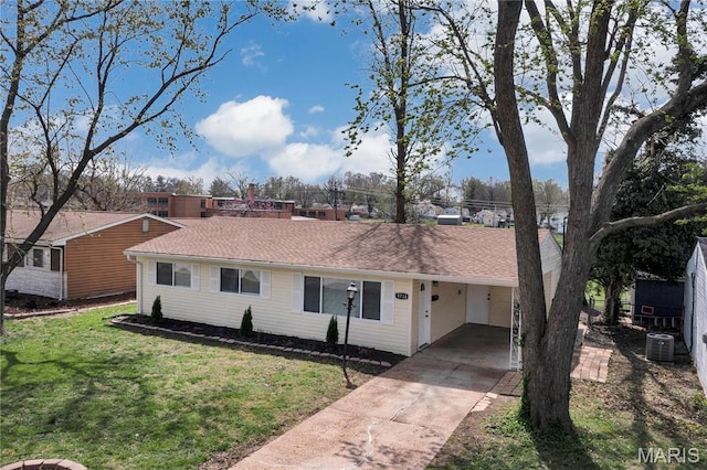 9738 Traverse Ln, Saint Louis, MO 63134 - ranch-style house featuring driveway, a front lawn, an attached carport, and central AC