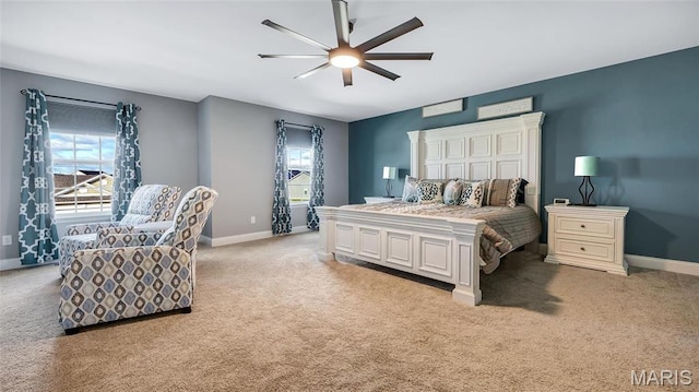 bedroom with light carpet and multiple windows