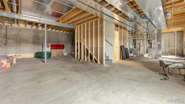 unfinished below grade area with stairs and heating unit