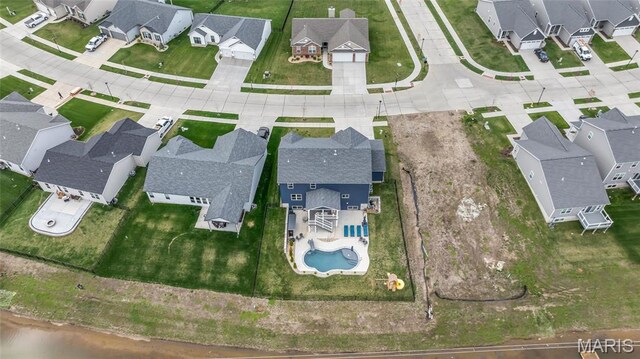 aerial view of residential area with a pool area
