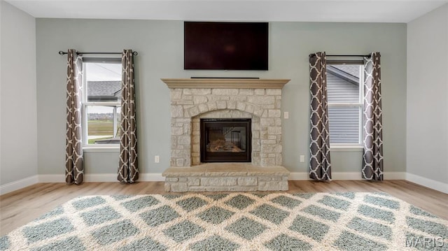 326 Summer Glen Ln, Saint Charles, MO 63301 - unfurnished living room featuring wood finished floors, a fireplace, and baseboards