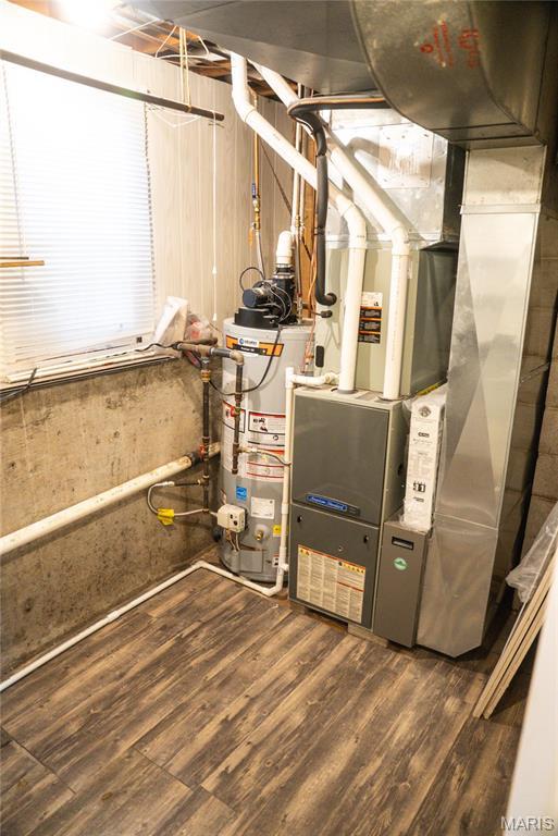 utilities featuring water heater and heating unit