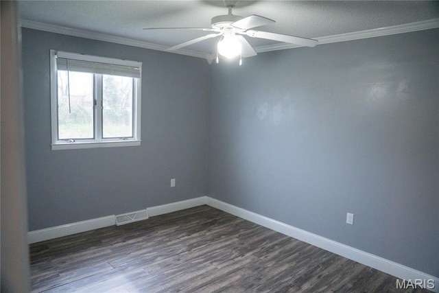 spare room with ornamental molding, a ceiling fan, dark wood-style flooring, and baseboards