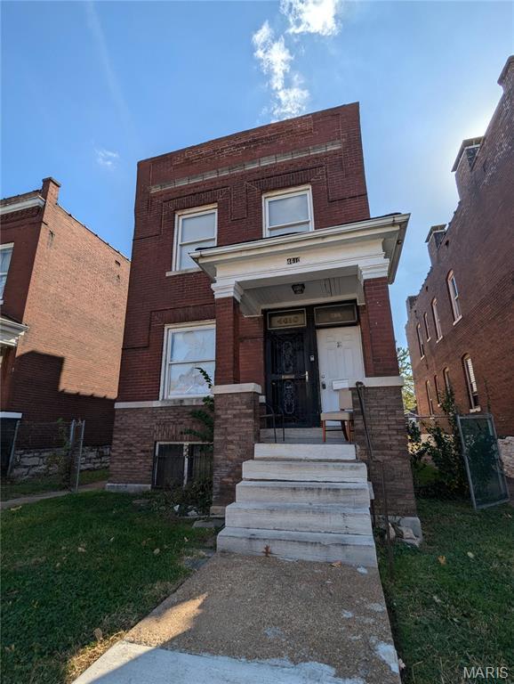 4610 Pope Ave, Saint Louis, MO 63115 - view of front of property featuring brick siding and a front yard