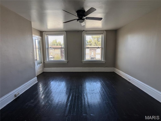 4610 Pope Ave, Saint Louis, MO 63115 - spare room featuring a ceiling fan, hardwood / wood-style floors, and baseboards