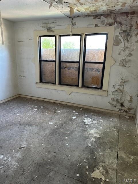4877 Carter Ave, Saint Louis, MO 63115 - spare room featuring baseboards