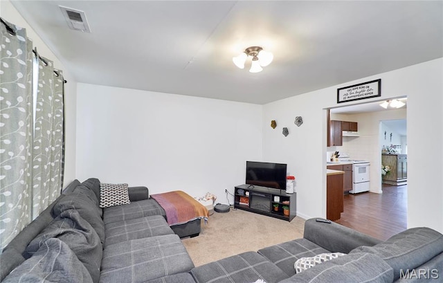 595 Cap Au Gris St, Troy, MO 63379 - living room featuring dark carpet