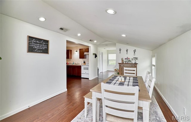 595 Cap Au Gris St, Troy, MO 63379 - dining space featuring dark wood-style floors, lofted ceiling, recessed lighting, and baseboards