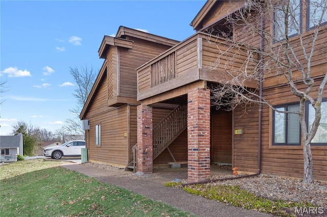 1009 Hemingway Ln Unit H, Weldon Spring, MO 63304 - view of home's exterior with a lawn