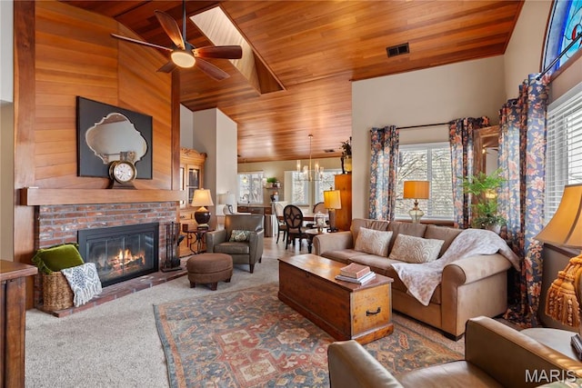 1009 Hemingway Ln Unit H, Weldon Spring, MO 63304 - carpeted living room featuring wooden ceiling, plenty of natural light, lofted ceiling, ceiling fan, and a brick fireplace