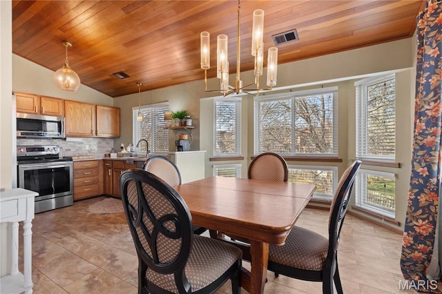 1009 Hemingway Ln Unit H, Weldon Spring, MO 63304 - dining space featuring wooden ceiling, a chandelier, light tile patterned floors, and vaulted ceiling