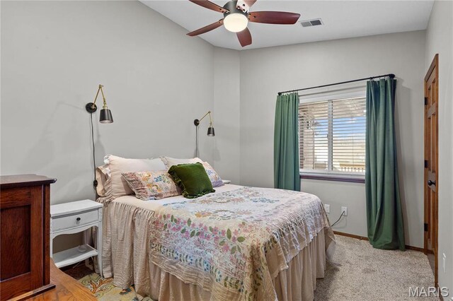1009 Hemingway Ln Unit H, Weldon Spring, MO 63304 - bedroom with baseboards, ceiling fan, and light colored carpet