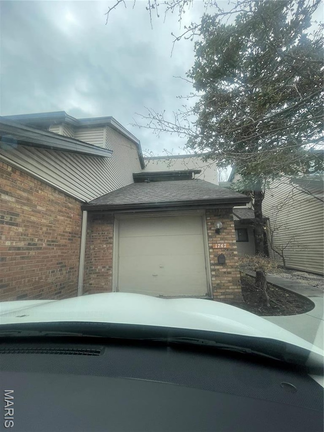 1747 Russet Valley Dr, Saint Louis, MO 63146 - view of home's exterior featuring brick siding and an attached garage