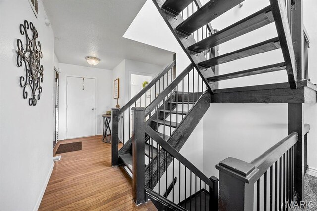 1747 Russet Valley Dr, Saint Louis, MO 63146 - foyer entrance featuring baseboards, wood finished floors, and stairs