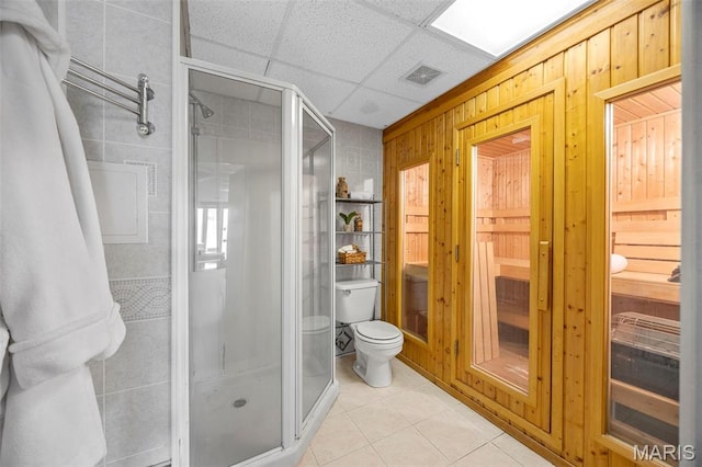 1747 Russet Valley Dr, Saint Louis, MO 63146 - bathroom featuring toilet, a stall shower, tile patterned floors, and wooden walls