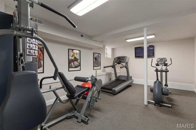 workout area featuring baseboards