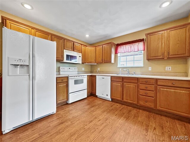 737 Marney Ln, Waterloo, IL 62298 - kitchen with white appliances, light wood-type flooring, light countertops, brown cabinets, and recessed lighting