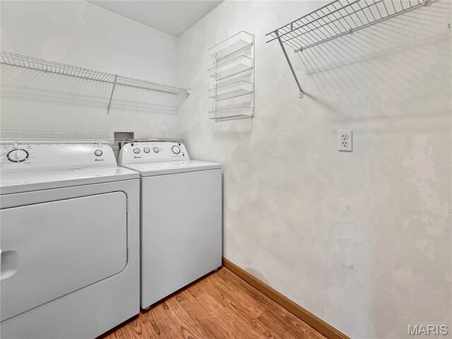 737 Marney Ln, Waterloo, IL 62298 - laundry area featuring separate washer and dryer and light wood-style flooring