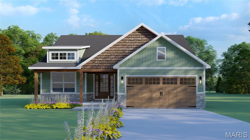 975 Half Moon Ln, Caseyville, IL 62232 - craftsman house featuring stone siding, concrete driveway, and an attached garage