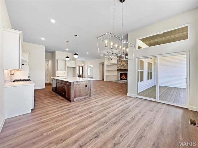 204 Great Bear Pass, Foristell, MO 63348 - kitchen featuring open floor plan, a sink, stainless steel dishwasher, light wood-type flooring, and recessed lighting