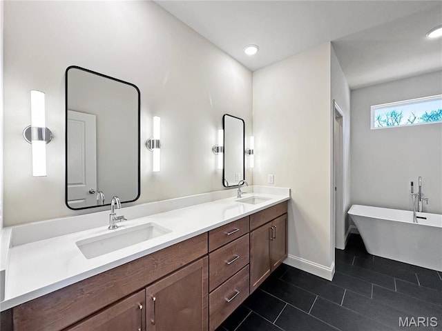 204 Great Bear Pass, Foristell, MO 63348 - bathroom with tile patterned flooring, double vanity, baseboards, a soaking tub, and recessed lighting