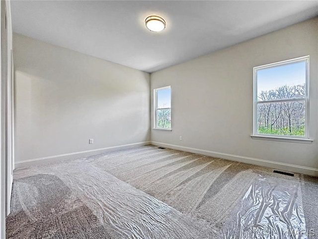 204 Great Bear Pass, Foristell, MO 63348 - spare room featuring baseboards and carpet floors