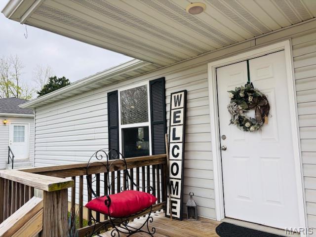 9 Mcleod St Unit A, Cuba, MO 65453 - wooden terrace featuring a porch