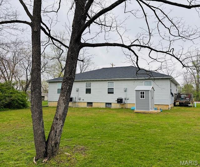 9 Mcleod St Unit A, Cuba, MO 65453 - rear view of property featuring a yard, a deck, and central AC