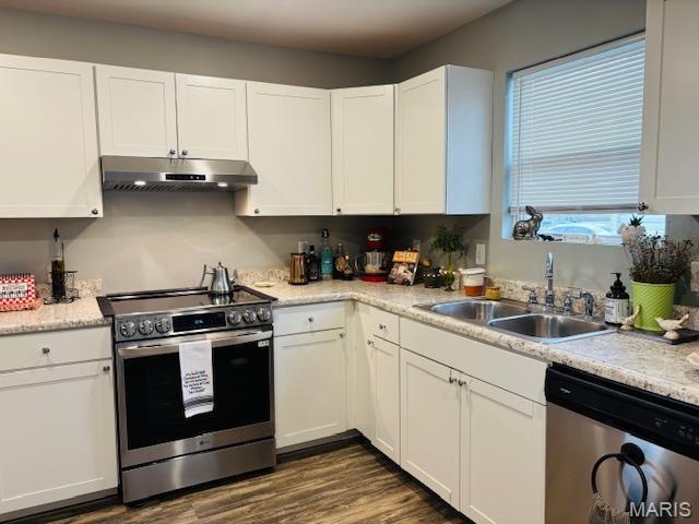 9 Mcleod St Unit A, Cuba, MO 65453 - kitchen featuring stainless steel appliances, under cabinet range hood, a sink, white cabinets, and light countertops