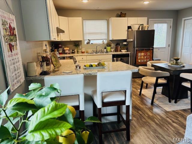 9 Mcleod St Unit A, Cuba, MO 65453 - kitchen featuring a sink, dark wood-type flooring, a peninsula, plenty of natural light, and recessed lighting