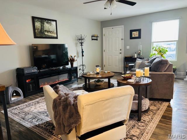 9 Mcleod St Unit A, Cuba, MO 65453 - living area featuring ceiling fan, wood finished floors, and a glass covered fireplace