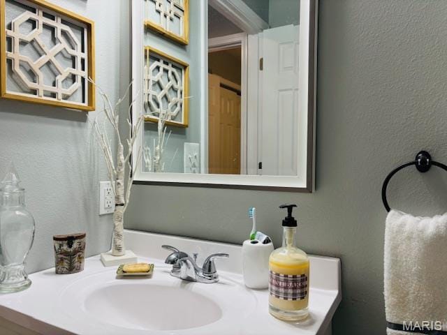 9 Mcleod St Unit A, Cuba, MO 65453 - bathroom with a textured wall and vanity