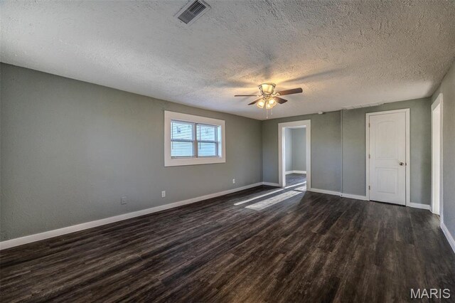 450 Michigan, Lebanon, MO 65536 - unfurnished bedroom featuring dark wood-style flooring, a textured ceiling, baseboards, and a ceiling fan