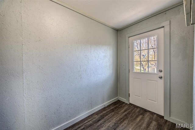 450 Michigan, Lebanon, MO 65536 - doorway to outside featuring dark wood finished floors, baseboards, and a textured wall