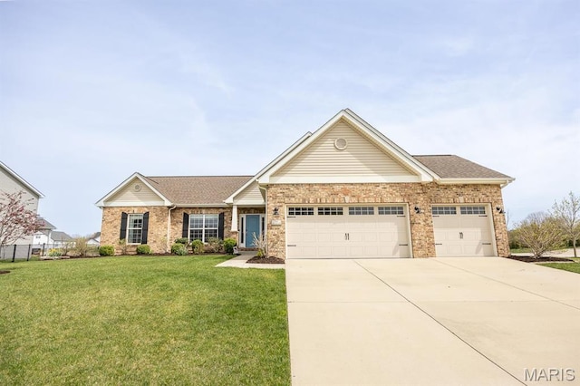 view of front of house featuring an attached garage, a front yard, driveway, and brick siding