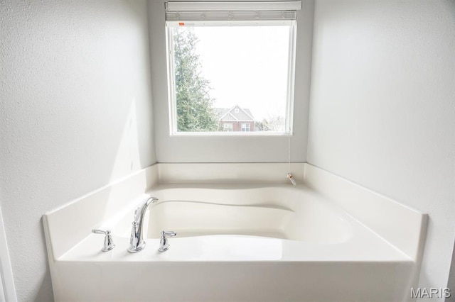 full bathroom with a bath