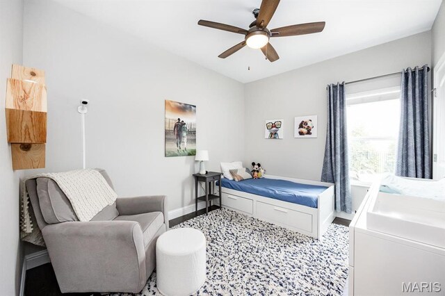 bedroom with baseboards and ceiling fan