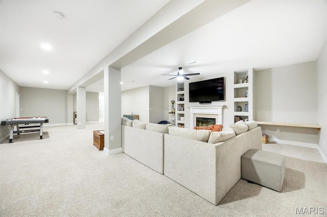 living room featuring carpet floors, a fireplace, baseboards, a ceiling fan, and recessed lighting