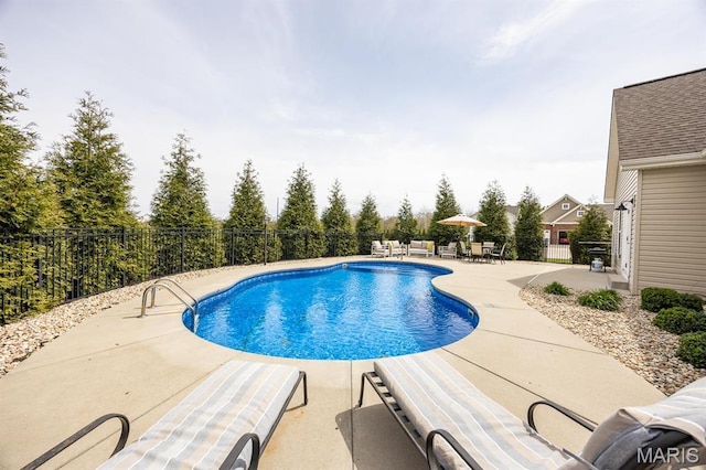 view of pool featuring a patio area and fence