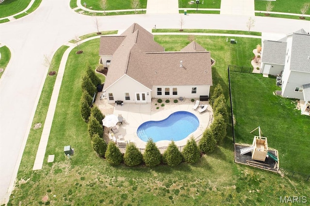aerial view of property and surrounding area with a pool