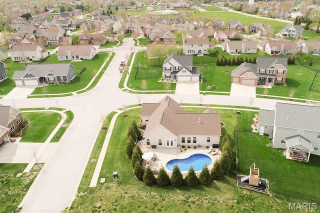aerial view of residential area with a pool