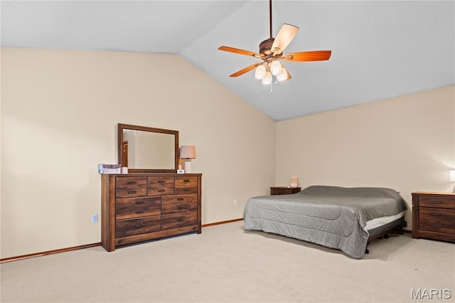 carpeted bedroom featuring vaulted ceiling, baseboards, and a ceiling fan