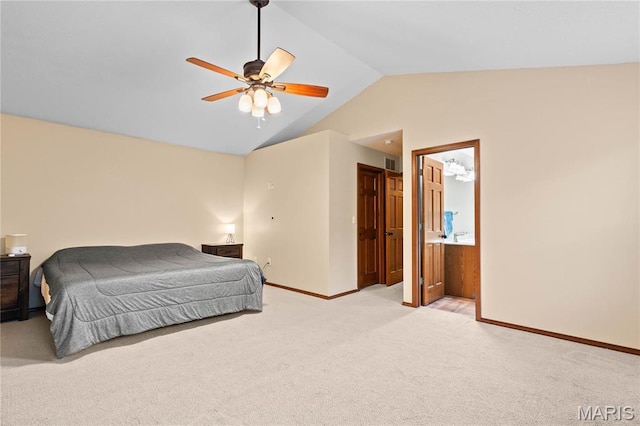 bedroom with light carpet, vaulted ceiling, baseboards, a ceiling fan, and ensuite bathroom