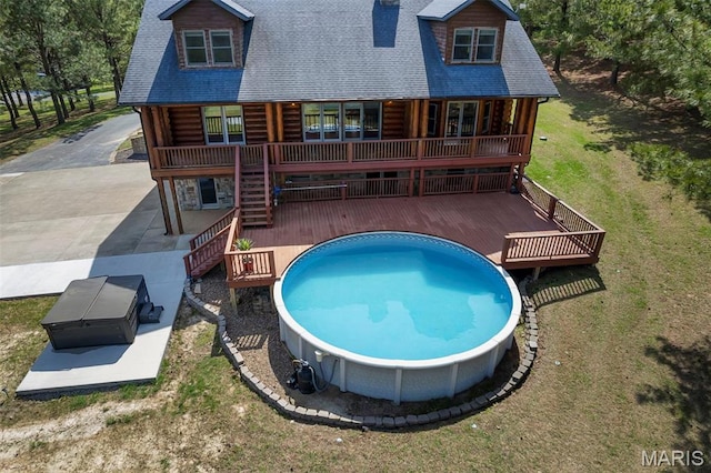 3333 State Highway 177, Cape Girardeau, MO 63701 - rear view of house featuring a wooden deck, log exterior, a shingled roof, and a yard